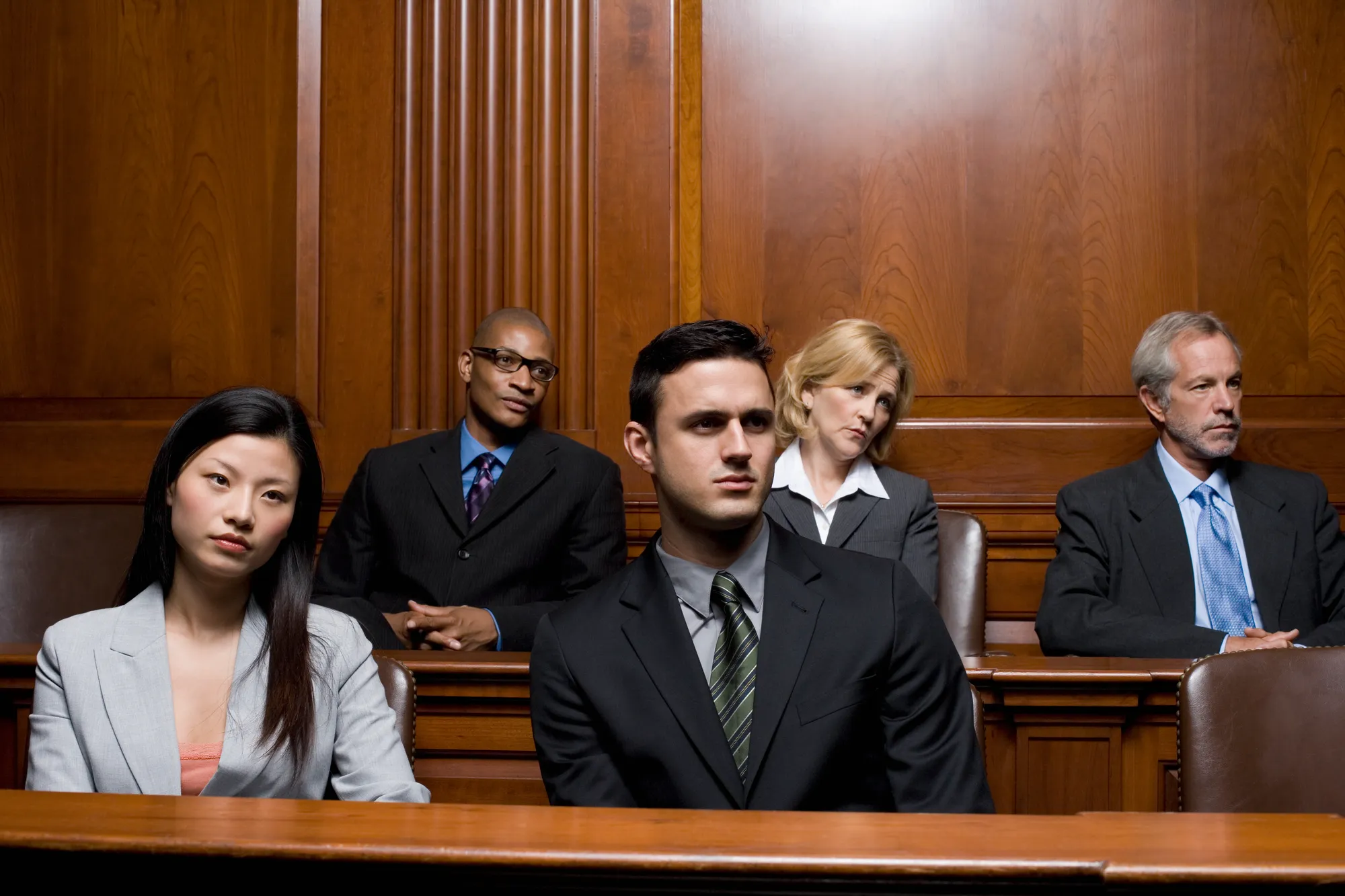 Five jurors looking focused and attentive